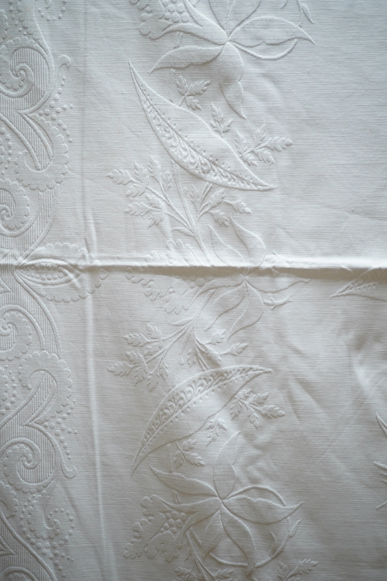 Three late 19th century white linen ‘Marcella’ style bedcovers, with inspired Christopher Dresser floral textile designs.